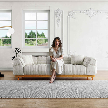 San Marino 3 Seater Cloud Fabric Sofa in a luxurious living room setting. This modern, plush sofa offers ultimate comfort with its soft woven fabric.